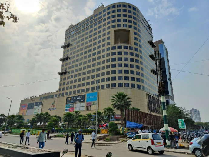 a group of people standing in front of a tall building